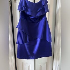 Deep purple silky strapless dress.
